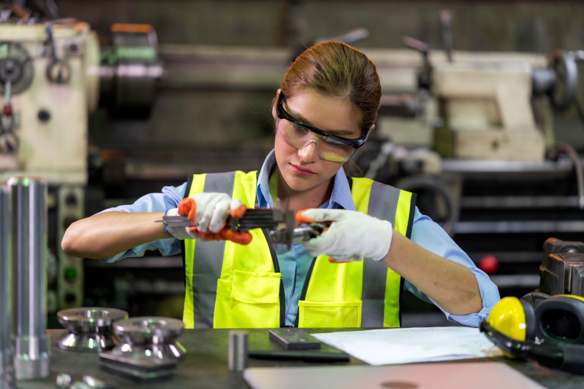 Quality inspection technician measuring a precision component